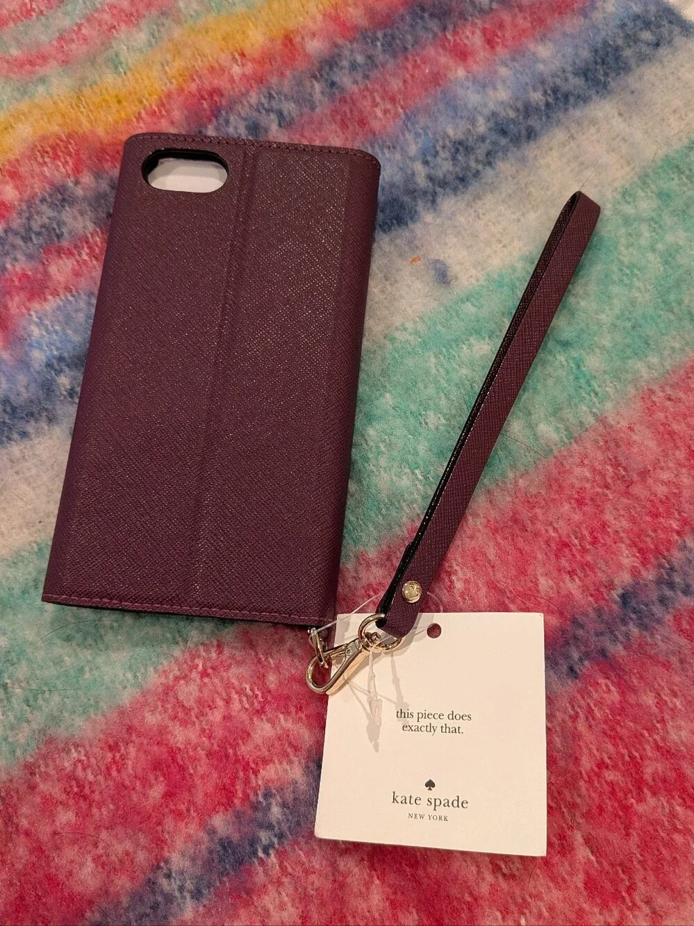 kate spade Plum Leather Wristlet Phone Case with Gold Logo